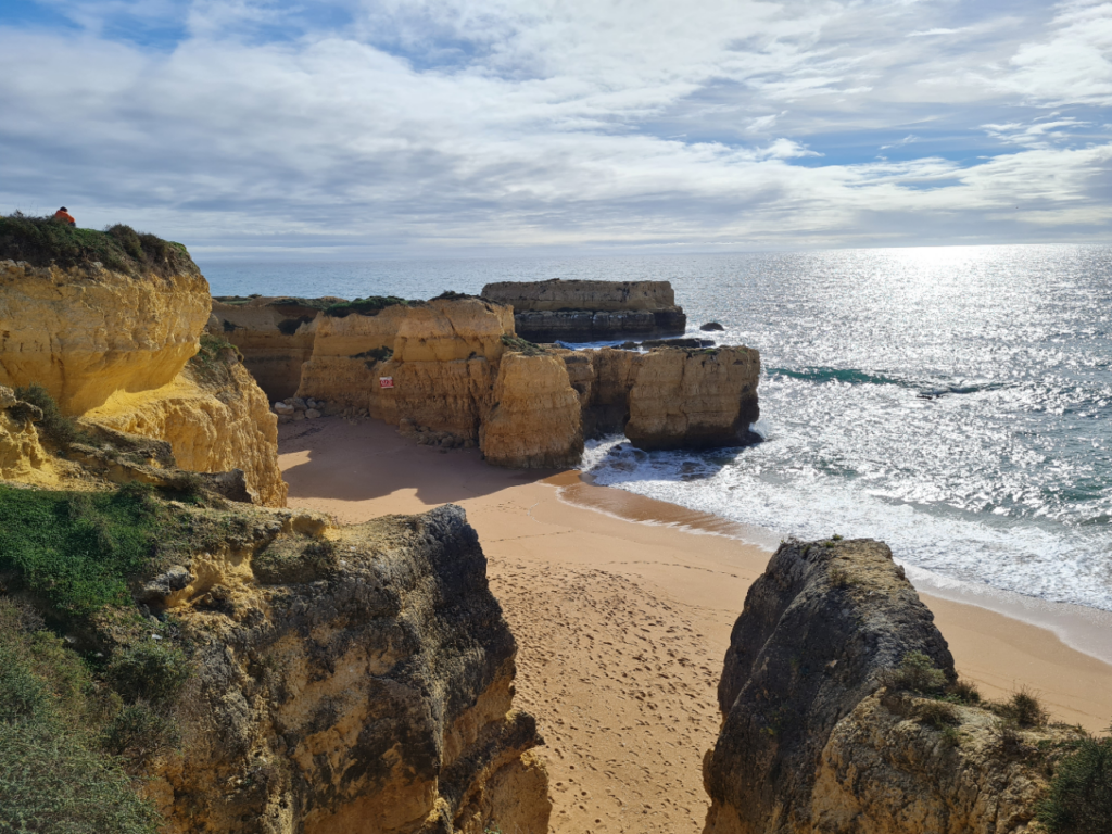 View of Albufeira coastline near Casa-Moooi, showcasing stunning beaches and vibrant local life.